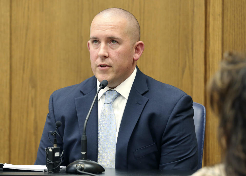 FILE - Wichita Police officer Justin Rapp describes the night he shot Andrew Finch on his front porch during a preliminary hearing on May 22, 2018, in Wichita, Kan. The city of Wichita on Tuesday, March 14, 2023, approved a $5 million settlement of a lawsuit filed by the family of Andrew Finch, who was shot and killed by the police officer during a hoax call in 2017. (Bo Rader/The Wichita Eagle via AP, File)