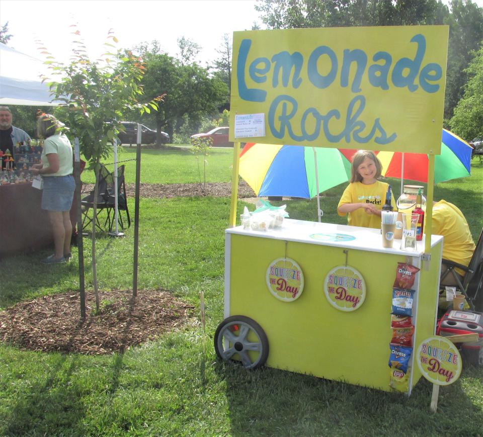 Addie Peterson had her Lemonade Rocks stand next to her grandfather's display booth at Secrest Arboretum.