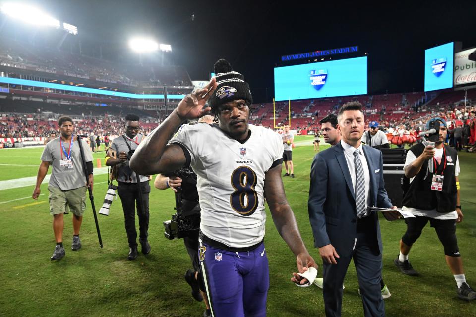 Baltimore Ravens quarterback Lamar Jackson walks off the field after the win over the Tampa Bay Buccaneers.