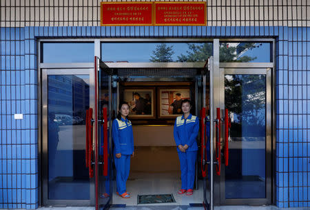 Plaques commemorating visits by North Korean leaders Kim Jng Il and Kim Jong Un are seen above a door at a cosmetic factory during a government organised trip for foreign reporters in Pyongyang, North Korea, September 8, 2018. Picture taken September 8, 2018. REUTERS/Danish Siddiqui