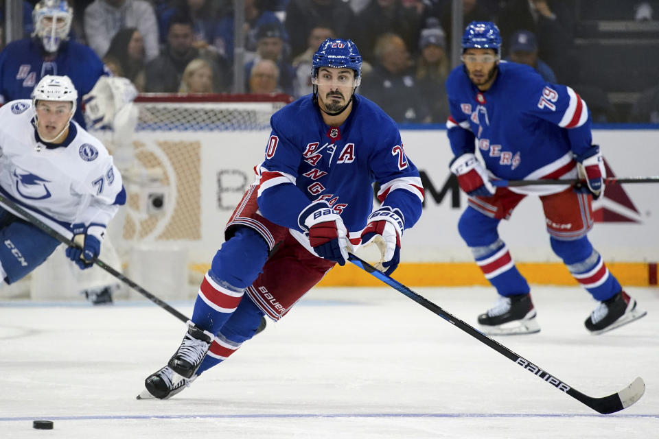 New York Rangers left wing Chris Kreider (20) skates toward the puck during the second period of the team's NHL hockey game against the Tampa Bay Lightning, Tuesday, Oct. 11, 2022, in New York. (AP Photo/Julia Nikhinson)