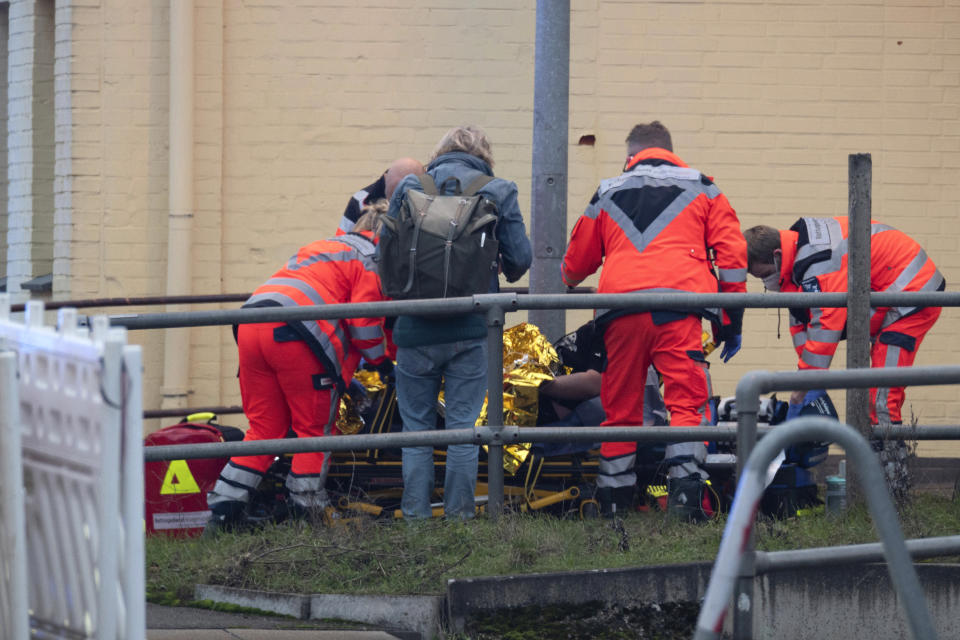 Emergency services work at Brokstedt station in Brockstedt, Germany, Wednesday, Jan. 25, 2023. A man stabbed and wounded several people on a train in northern Germany on Wednesday before police detained him, and two of the victims died, German news agency dpa reported. (Jonas Walzberg/dpa via AP)