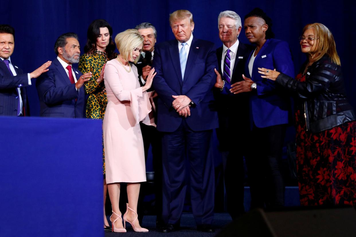 President Donald Trump participates in a prayer before speaking at an Evangelicals for Trump coalition launch at the King Jesus International Ministry in Miami on Jan. 3, 2020. (Photo: Tom Brenner/Reuters)