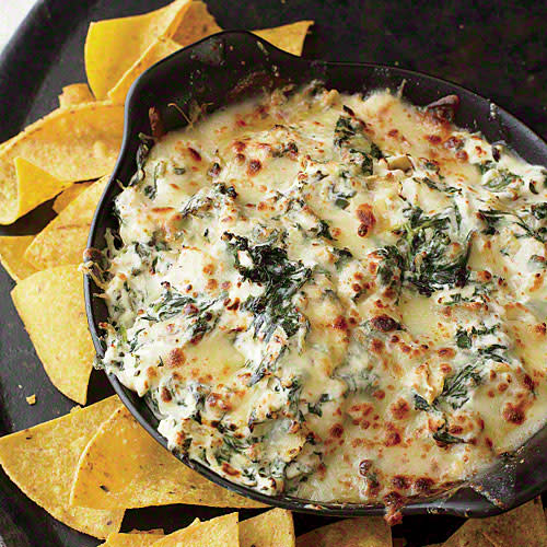 <p><span>This recipe</span> <span>has been a staff favorite since we first tried it 13 years ago. It's rich, savory, and super creamy, with a nice hit of garlic. We made a few small tweaks—increased the amount of spinach and decreased the mozzarella to lower the sat fat to an acceptable level. </span></p> <p><a rel="nofollow noopener" href="http://www.myrecipes.com/recipe/spinach-and-artichoke-dip-0" target="_blank" data-ylk="slk:View Recipe: Spinach and Artichoke Dip;elm:context_link;itc:0;sec:content-canvas" class="link ">View Recipe: Spinach and Artichoke Dip</a></p>