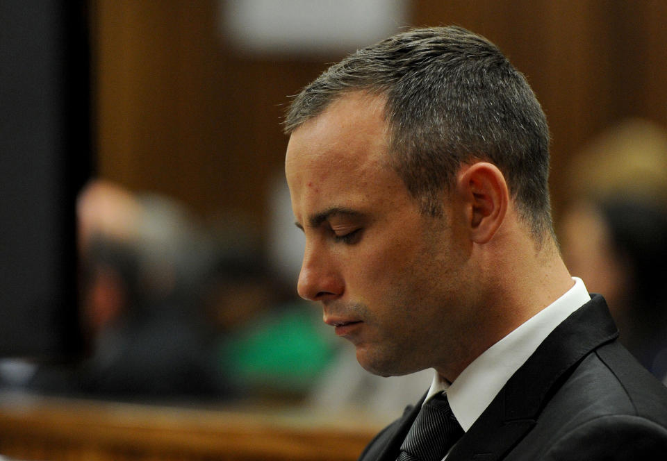 Oscar Pistorius in court for his ongoing murder trial in Pretoria, South Africa, Monday, May 12, 2014. Pistorius is charged with the shooting death of his girlfriend Reeva Steenkamp on Valentine's Day in 2013. (AP Photo/Chris Collingridge, Pool)