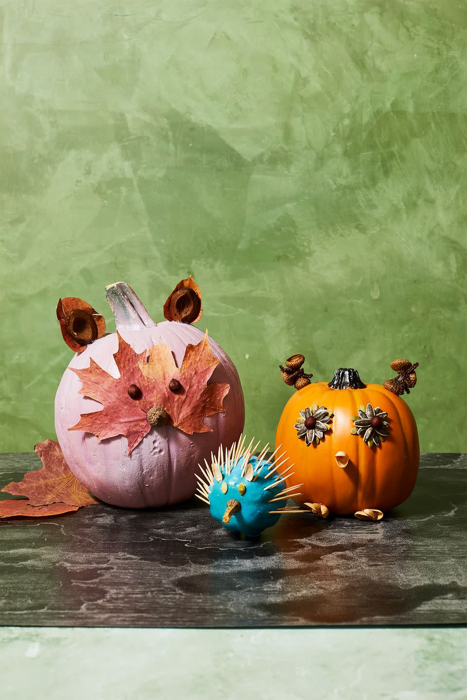 <p>Say <em>hello</em> to our little friends! Gather acorns, sunflower seeds, dried leaves, toothpicks, and some nuts. Then, hot glue 'em on your pumpkins to create each of these adorable animals. </p>
