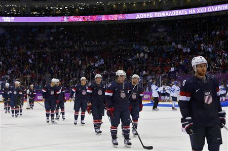 Team USA players leave the ice after being defeated by Finland in their men's ice hockey bronze medal game at the Sochi 2014 Winter Olympic Games February 22, 2014. REUTERS/Laszlo Balogh