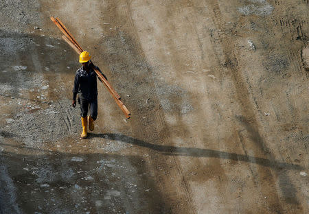 A worker walks at the construction site where locally transmitted Zika cases were first discovered in Singapore