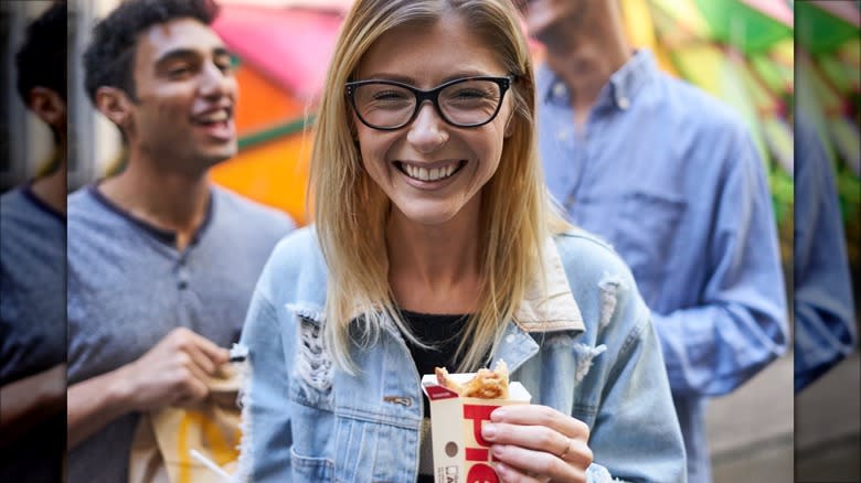 Woman holding McDonald's Apple Pie box