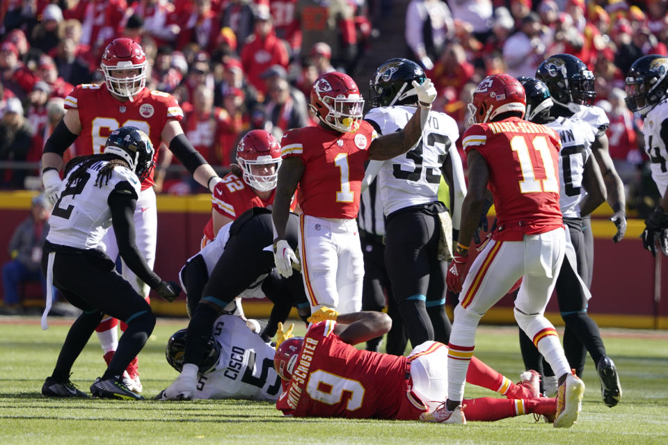 Kansas City Chiefs wide receiver JuJu Smith-Schuster (9) rolls on the field after being injured during the first half of an NFL football game against the Jacksonville Jaguars Sunday, Nov. 13, 2022, in Kansas City, Mo. (AP Photo/Ed Zurga)