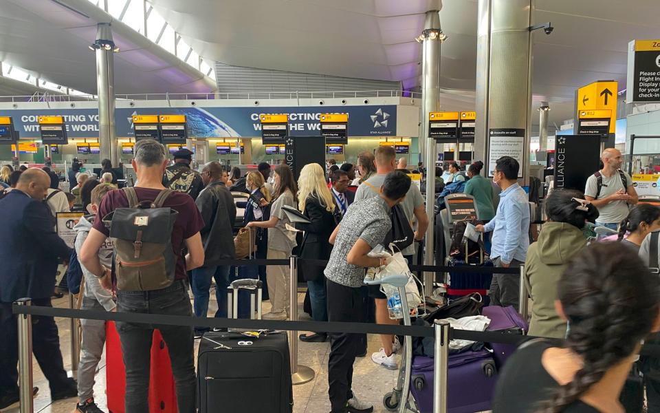 Passengers queue to check-in at Heathrow during the summer disruption last summer - Steve Parsons/PA Wire