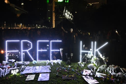 Tens of thousands of people in Hong Kong attended a peaceful vigil to mark the death of a 22-year-old student