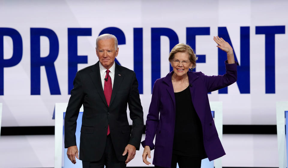 Democratic presidential candidates former Vice President Joe Biden and Senator Elizabeth Warren pose together at the start of the fourth U.S. Democratic presidential candidates 2020 election debate at Otterbein University in Westerville, Ohio U.S., October 15, 2019. REUTERS/Shannon Stapleton     TPX IMAGES OF THE DAY