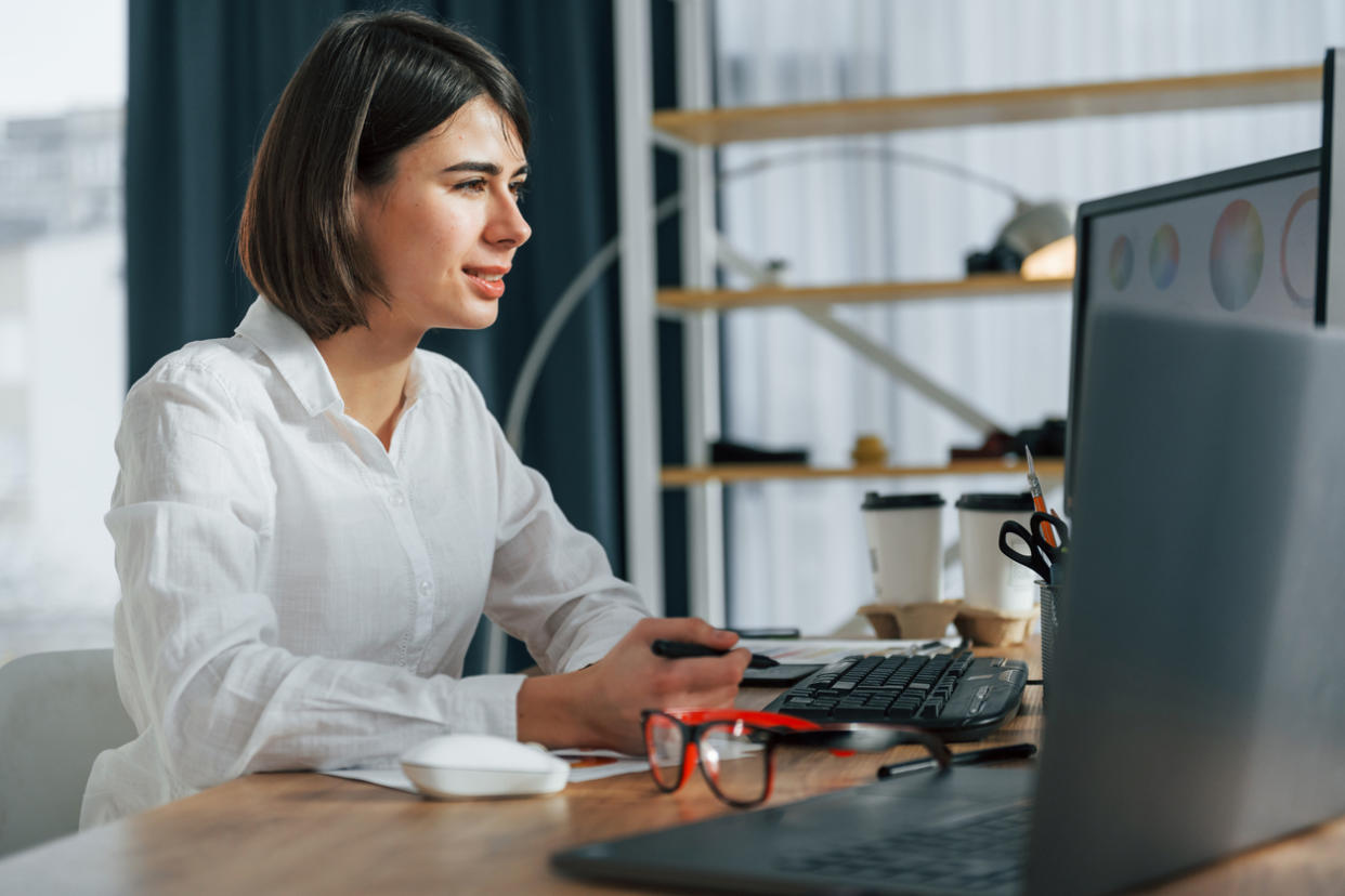 An investor analyzing different investments for her portfolio.