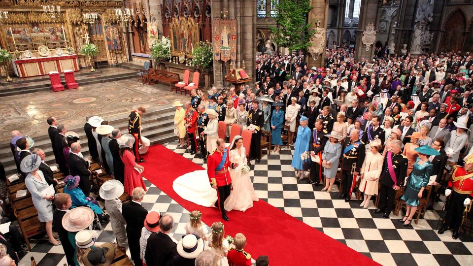 Prince William and his new bride Kate Middleton walk down the aisle at the close of their wedding ceremony at Westminster Abbey