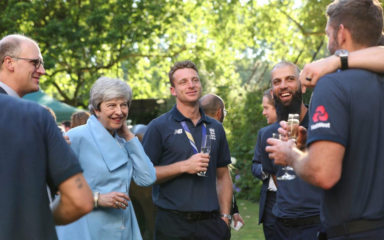 Prime Minister Theresa May with Jos Buttler and members of the England cricket team - PA POOL