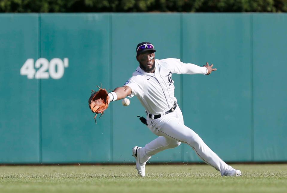 Akil Baddoo (60) of the Detroit Tigers fields a single hit by Jorge Polanco of the Minnesota Twins to load the bases during the first inning at Comerica Park on July 23, 2022, in Detroit, Michigan.