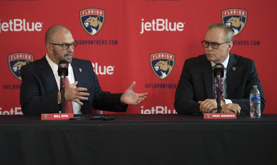 Paul Maurice, right, new head coach of the Florida Panthers, and general manager Bill Zito take questions during an NHL hockey news conference at FLA Live Arena, Friday, June 23, 2022, in Sunrise, Fla. (AP Photo/Jim Rassol)