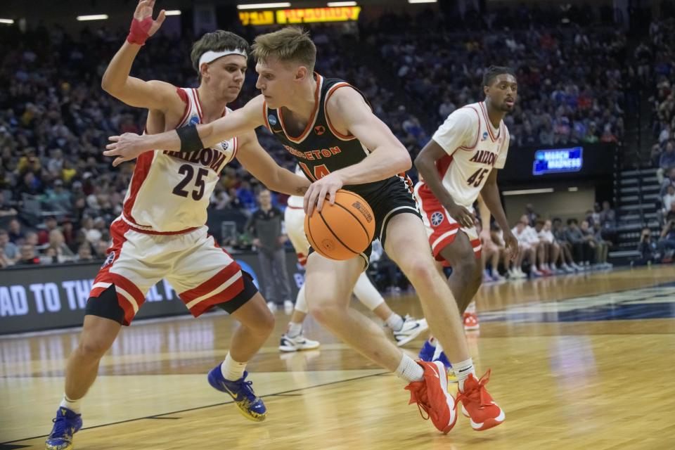 Princeton guard Matt Allocco, right, is guarded by Arizona guard Kerr Kriisa (25) during the first half of a first-round college basketball game in the NCAA Tournament in Sacramento, Calif., Thursday, March 16, 2023. (AP Photo/Randall Benton)