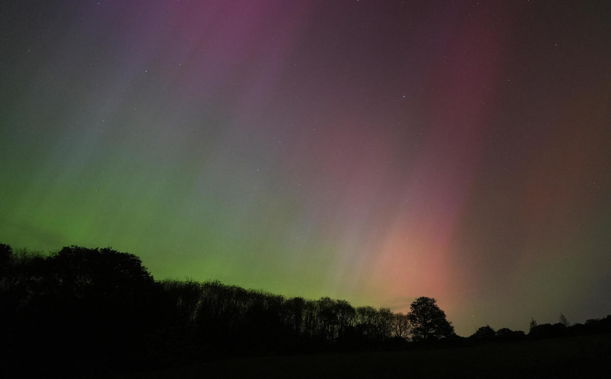 The aurora borealis, also known as the northern lights, glow on the horizon over Basingstoke in Hampshire, England, May 10, 2024. / Credit: Andrew Matthews/PA Images via Getty Images