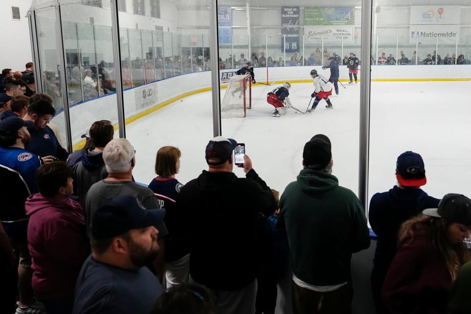 Jul 2, 2023; Columbus, Ohio, USA;  Fans watch as forward Adam Fantilli (11) shoots at goaltender Melvin Strahl (60) during the Columbus Blue Jackets development camp at the OhioHealth Chiller North in Lewis Center. 