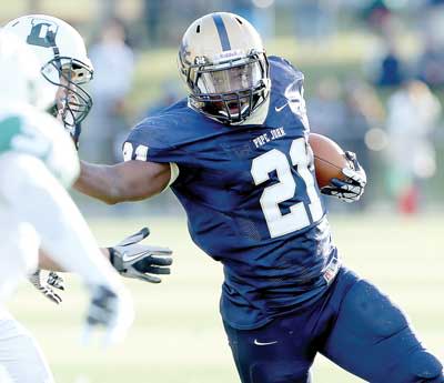 Pope John's Noah Brown (21) stiff-arms his way for a touchdown during the second half of Saturday's Non-Public, Group 3 semifinal at Pope John High School. The Lions won, earning their first championship-game berth in 11 years.