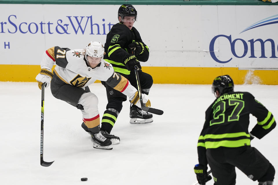 Vegas Golden Knights center William Karlsson (71) competes for possession against Dallas Stars defenseman Nils Lundkvist (5) and left wing Mason Marchment (27) during the third period of an NHL hockey game, Wednesday, Nov. 22, 2023, in Dallas. (AP Photo/Tony Gutierrez)