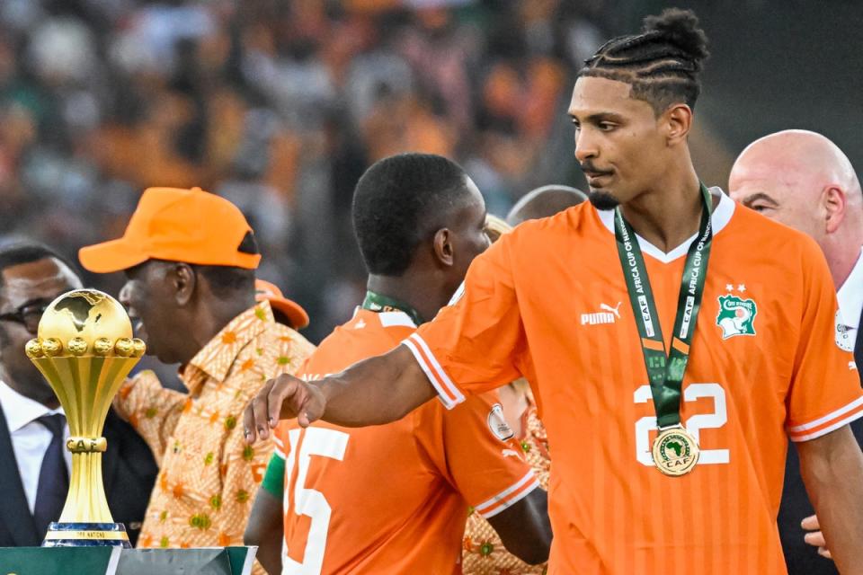 Haller touches the Afcon trophy after scoring in the final (AFP via Getty Images)
