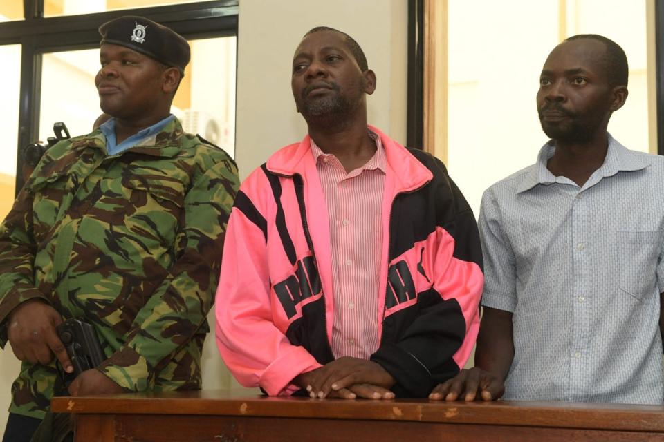 Self-proclaimed pastor Paul Nthenge Mackenzie (centre), who set up the Good News International Church in 2003, is accused of inciting cult followers to starve to death ‘to meet Jesus’ (AFP via Getty Images)