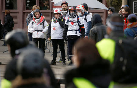 Members of the "Street Medics" looks on during a demonstration of the "yellow vests" movement in Nantes, France, January 26, 2019. REUTERS/Stephane Mahe