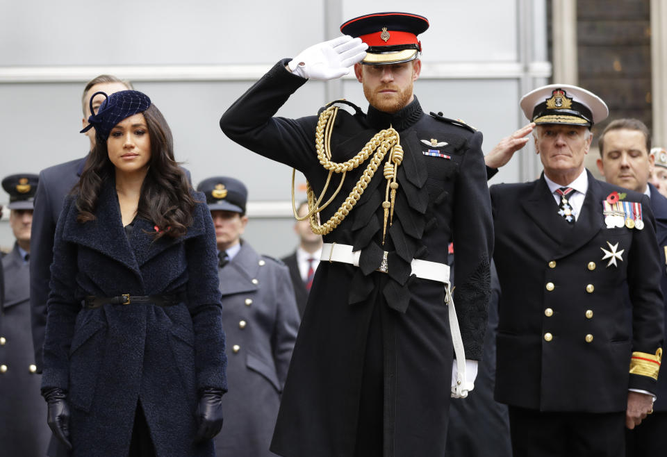 FILE - In this Thursday, Nov. 7, 2019 file photo, Britain's Prince Harry and Meghan, the Duchess of Sussex attend the 91st Field of Remembrance at Westminster Abbey in London. In a stunning declaration, Britain’s Prince Harry and his wife, Meghan, said they are planning “to step back” as senior members of the royal family and “work to become financially independent.” A statement issued by the couple Wednesday, Jan. 8, 2020 also said they intend to “balance” their time between the U.K. and North America. (AP Photo/Kirsty Wigglesworth, file)