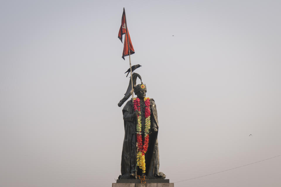 A crow sits on the statue of Nepal's late king Birendra Bir Bikram Shah in Kathmandu, Nepal, March 1, 2024. Nepal’s once unpopular monarchy — abolished after centuries of rule over the Himalayan nation — is hoping to regain some of its lost glory. Royalist groups and supporters of former King Gyanendra have been holding rallies to demand the restoration of the monarchy and the nation’s former status as a Hindu state. (AP Photo/Niranjan Shrestha)