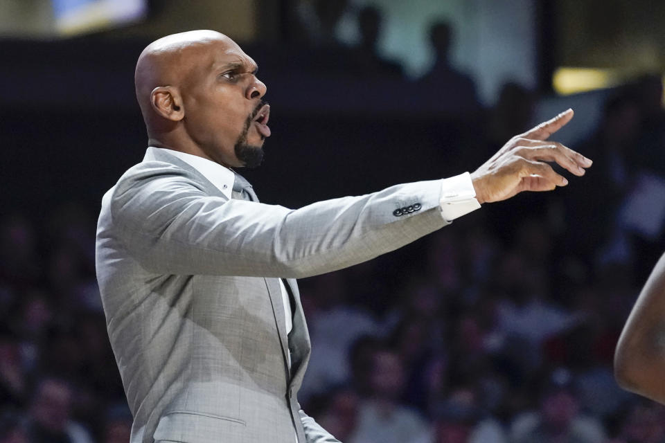 FILE — Vanderbilt head coach Jerry Stackhouse directs his players in the first half of an NCAA college basketball game against Dayton, March 20, 2022, in Nashville, Tenn. With Scotty Pippen Jr. gone, Stackhouse has a roster that should keep the Commodores from missing the Southeastern Conference's top scorer. (AP Photo/Mark Humphrey, File)