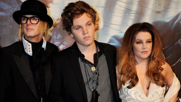 Michael Lockwood, Ben Keough and Lisa Marie Presley attend the World Premiere of <a href="https://parade.com/955587/kelseypelzer/harry-potter-quotes/" rel="nofollow noopener" target="_blank" data-ylk="slk:Harry Potter;elm:context_link;itc:0;sec:content-canvas" class="link ">Harry Potter</a> And The Deathly Hallows: Part 1.<p>Dave M. Benett/Getty Images</p>