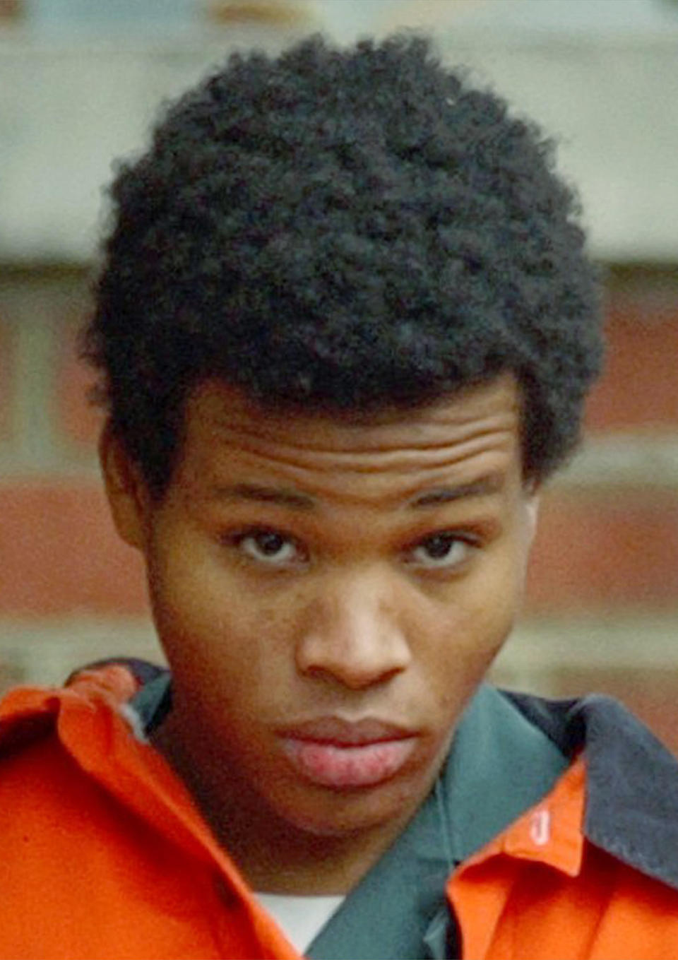 FILE -- Lee Boyd Malvo is escorted out of Fairfax Juvenile and Domestic Relations Court after a hearing in Fairfax, Va. on Dec. 30, 2002. An eight-episode docuseries, “I, Sniper,” features Malvo, half of a two-man sniper team that killed 10 and terrorized the Washington D.C. region in 2002. The filmmakers coaxed Malvo to examine his life over 17 hours of phone calls. The series starts Monday on Vice TV. (AP Photo/Susan Walsh/file)