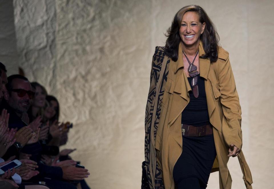 Fashion Designer Donna Karan is applauded after her Spring 2014 Donna Karan collection was modeled during Fashion Week in New York, Monday, Sept. 9, 2013. (AP Photo/Craig Ruttle)