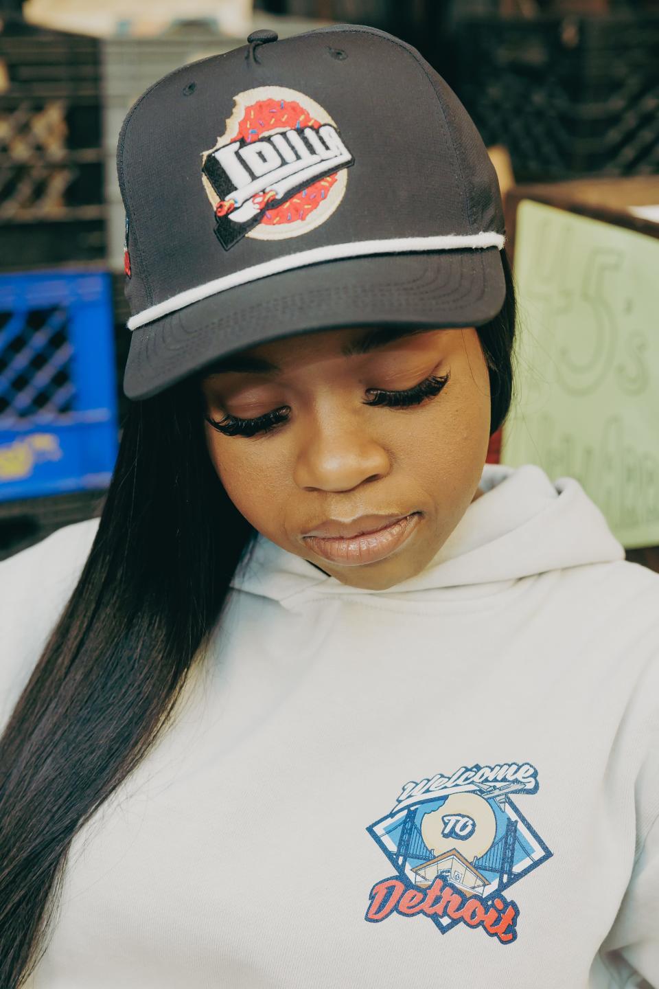 Ja’Mya Yancey, the 22-year-old daughter of the late hip-hop producer-songwriter J Dilla, models a hat and hoodie from the new "Detroit Pistons x J Dilla" retail line.