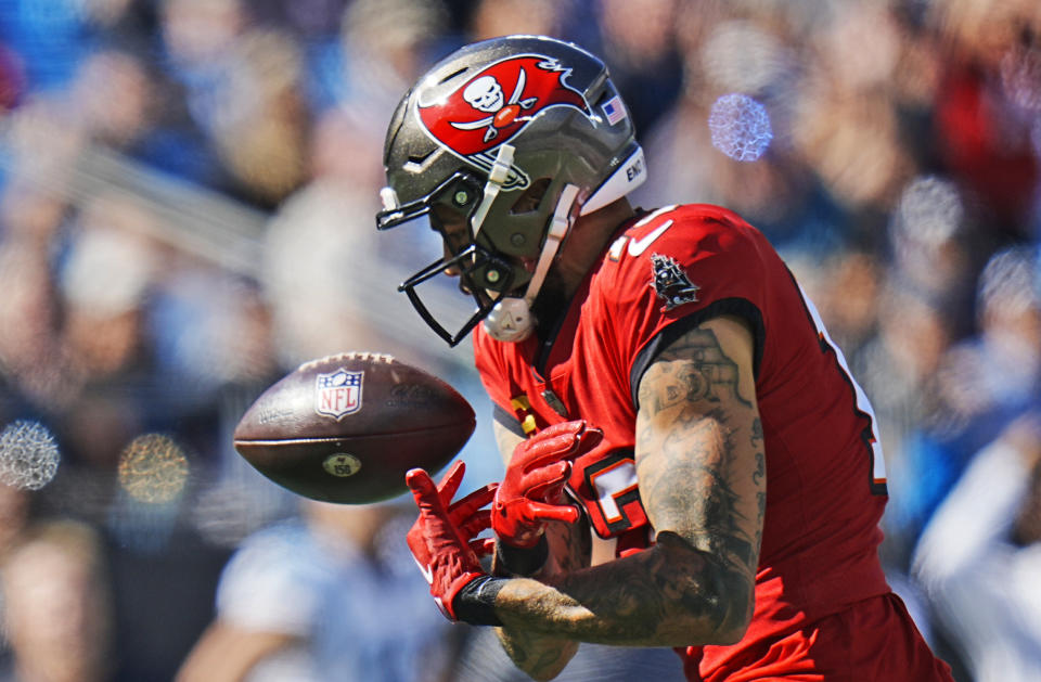 Tampa Bay Buccaneers wide receiver Mike Evans (13) drops a pass during the first half of an NFL football game against he Carolina Panthers Sunday, Oct. 23, 2022, in Charlotte, N.C. (AP Photo/Rusty Jones)