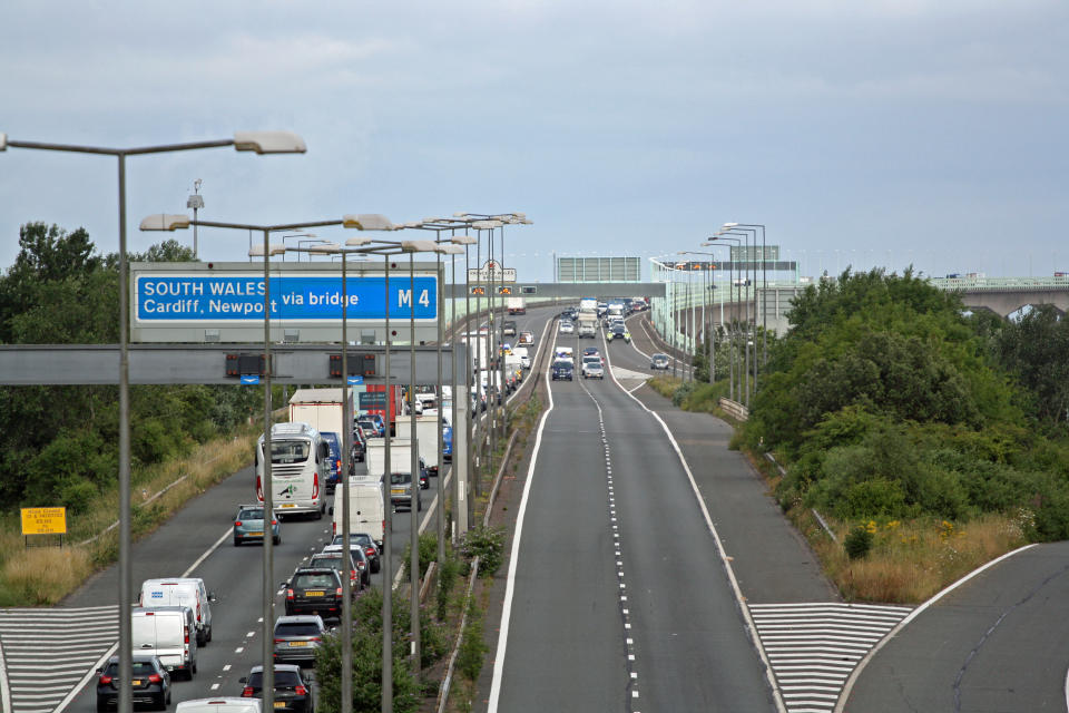 Police escort vehicles across the Prince of Wales Bridge, which runs between England and Wales, during the morning rush hour as drivers hold a go-slow protest on the M4. Police have warned of 