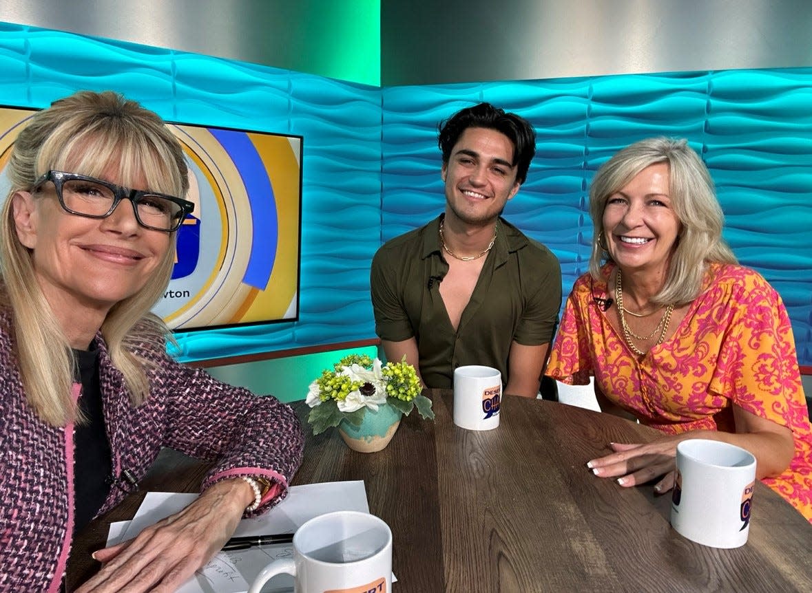 Sandie Newton speaks to Nickerson-Rossi dancer Chad Allen Ortiz and supporter Laurie Bianchin.