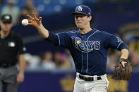 Tampa Bay Rays third baseman Joey Wendle makes a barehanded stop on an infield single by Seattle Mariners' Abraham Toro during the fourth inning of a baseball game Wednesday, Aug. 4, 2021, in St. Petersburg, Fla. (AP Photo/Chris O'Meara)