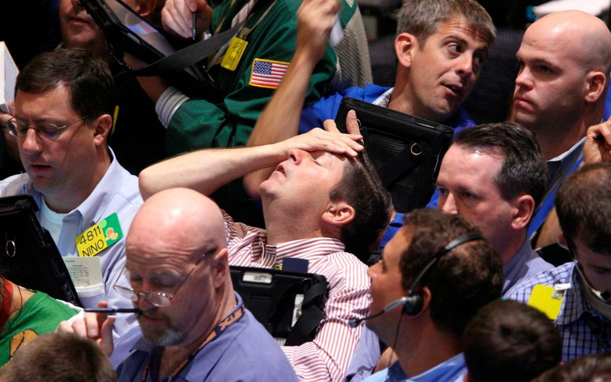 Stock market traders - Seth Wenig/AP