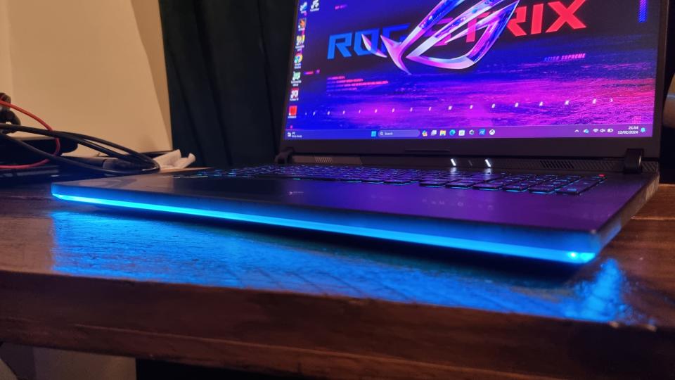 The Asus ROG Strix Scar 18's underglowing light bar, lit up in blue