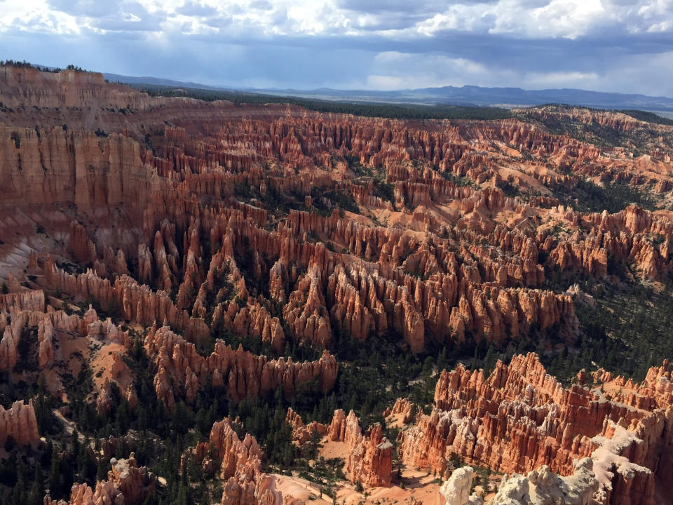 FILE - This May 25, 2017 file photo shows a view of the world-famous hoodoos, also called tent rocks, fairy chimneys and earth pyramids, at Inspiration Point in Bryce Canyon National Park in Utah. Officials say a tour bus has crashed near a national park in southern Utah, killing at least four people. Utah Highway Patrol troopers said Friday, Sept. 20, 2019 that the crash on a highway near Bryce Canyon National Park also left a number of people seriously injured. (AP Photo/Eva Parziale, Fila)