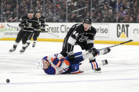Edmonton Oilers left wing Zach Hyman (18) falls after colliding with Los Angeles Kings defenseman Mikey Anderson (44) during the third period in Game 4 of an NHL hockey Stanley Cup first-round playoff series Sunday, April 28, 2024, in Los Angeles. (AP Photo/Mark J. Terrill)