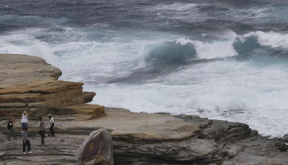 Waves hit the shore in Shirahama, Wakayama prefecture, western Japan Monday, Aug. 14, 2023. A storm that used to be a typhoon has made a landfall at Japan's central region Tuesday and hitting large areas of western Japan with heavy rain and high winds. (Kyodo News via AP)