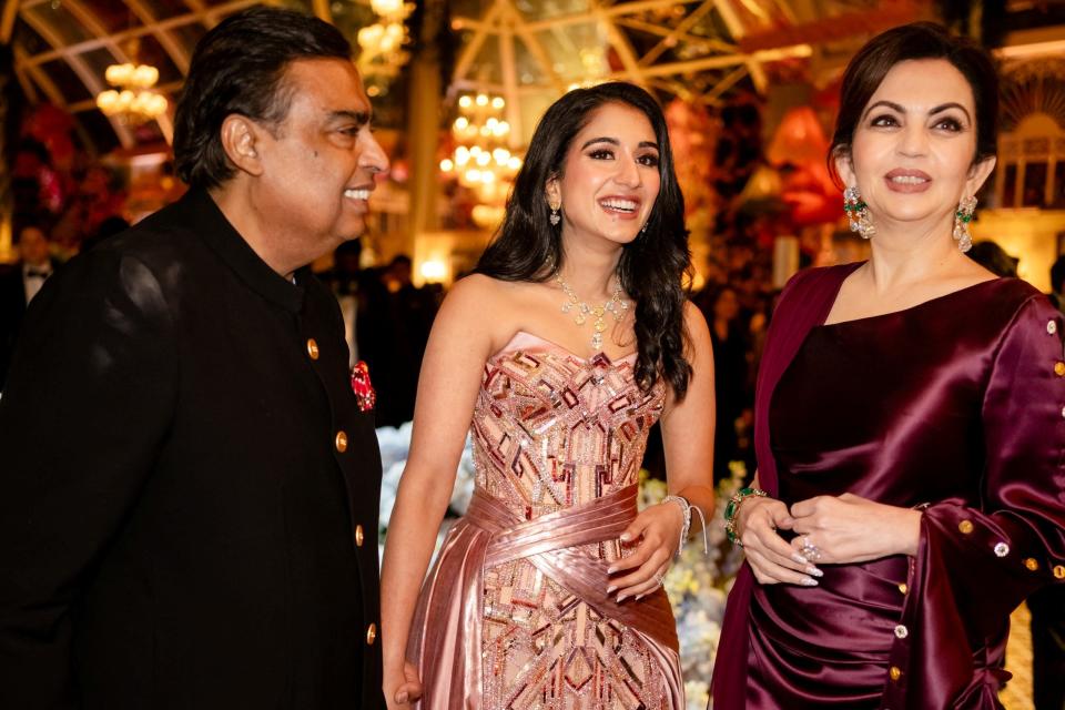 Mukesh Ambani, the Chairman of Reliance Industries, Radhika Merchant and Nita Ambani, share a moment during the pre-wedding celebrations of Anant Ambani and Radhika in Jamnagar, Gujarat, India, March 1, 2024.