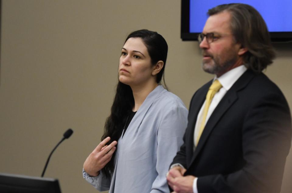 Bdour Al-Yasari appears in Judge Joyce Draganchuk’s courtroom, Tuesday, April 5, 2022, at Veterans Memorial Courthouse in Lansing with one of her attorneys Dan Eckhart. She is standing trial for the murder of her husband, Ammar Al-Yasari.