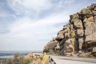 <p><strong>The Drive: </strong><a href="https://www.tripadvisor.com/ShowUserReviews-g51429-d117490-r157970694-Wichita_Mountains_National_Wildlife_Refuge-Indiahoma_Oklahoma.html" rel="nofollow noopener" target="_blank" data-ylk="slk:Wichita Mountains Scenic Byway;elm:context_link;itc:0;sec:content-canvas" class="link ">Wichita Mountains Scenic Byway</a></p><p><strong>The Scene: </strong>Located in southwestern Oklahoma, the <a href="https://www.tripadvisor.com/Attraction_Review-g51429-d117490-Reviews-Wichita_Mountains_National_Wildlife_Refuge-Indiahoma_Oklahoma.html" rel="nofollow noopener" target="_blank" data-ylk="slk:Wichita Mountains;elm:context_link;itc:0;sec:content-canvas" class="link ">Wichita Mountains</a> Scenic Byway offers some of the prettiest wildflower sightings in the spring, and amazing fall foliage views in the fall.</p><p><strong>The Pit-Stop: </strong>Climb <a href="https://www.tripadvisor.com/ShowUserReviews-g51429-d117490-r131070249-Wichita_Mountains_National_Wildlife_Refuge-Indiahoma_Oklahoma.html" rel="nofollow noopener" target="_blank" data-ylk="slk:Mt. Scott;elm:context_link;itc:0;sec:content-canvas" class="link ">Mt. Scott</a> to get a panoramic view of the surrounding mountains.</p>