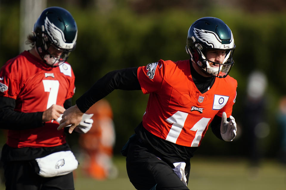 Philadelphia Eagles' Carson Wentz (11) and Nate Sudfeld (7) run between drills during practice at the NFL football team's training facility, Thursday, Nov. 19, 2020, in Philadelphia. (AP Photo/Matt Slocum, Pool)